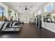 Bright gym with treadmills, stationary bike, weights, and mirrors at 8378 Randal Park Blvd, Orlando, FL 32832