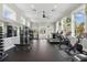 Bright gym with treadmills, stationary bike, weights, and mirrors at 8378 Randal Park Blvd, Orlando, FL 32832
