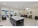 Open kitchen featuring center island and seamless flow into the living area at 8378 Randal Park Blvd, Orlando, FL 32832