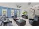 Bright living room featuring tile floors, comfortable seating, and ample natural light at 8378 Randal Park Blvd, Orlando, FL 32832