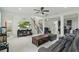 Spacious living room with tile flooring, staircase, and seamless access to the kitchen at 8378 Randal Park Blvd, Orlando, FL 32832