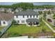 Aerial view of a home showcasing a well-maintained lawn and covered back patio at 8378 Randal Park Blvd, Orlando, FL 32832
