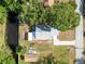 Birds eye view of home with water canal access and boat on property at 106 Edgewater Dr, St Cloud, FL 34769