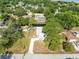 Neighborhood aerial view showcasing water access, lush greenery and mature trees at 106 Edgewater Dr, St Cloud, FL 34769