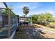 The backyard has a lovely deck with shade, dining and comfortable seating near a canal at 106 Edgewater Dr, St Cloud, FL 34769