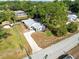 Charming home featuring a long driveway, boat, and lush landscaping at 106 Edgewater Dr, St Cloud, FL 34769