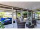 This spacious patio with comfortable seating overlooks a serene backyard at 106 Edgewater Dr, St Cloud, FL 34769