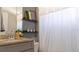 Bathroom featuring modern floating shelves, and neutral color palette at 109 Lily Ln, Poinciana, FL 34759