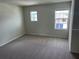 Bedroom with carpeted flooring and windows providing natural light at 1148 Sugarwood St, Davenport, FL 33837