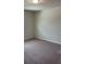 Cozy carpeted bedroom with neutral walls and ample space at 1148 Sugarwood St, Davenport, FL 33837