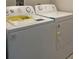 Laundry room featuring a white washer and dryer set at 1148 Sugarwood St, Davenport, FL 33837