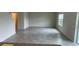 Spacious living room with ceramic flooring and plenty of natural light at 1148 Sugarwood St, Davenport, FL 33837