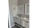 Elegant bathroom vanity with double sinks and framed mirrors at 1256 S Bumby Ave, Orlando, FL 32806