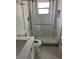 Modern bathroom with toilet, vanity and glass door shower at 1256 S Bumby Ave, Orlando, FL 32806