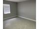 Bedroom featuring tile floor, neutral wall color, and window with blinds at 1256 S Bumby Ave, Orlando, FL 32806