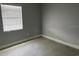 Minimalist bedroom featuring tiled floors and a window for natural light at 1256 S Bumby Ave, Orlando, FL 32806