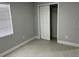 Bedroom featuring a closet, tile floor, neutral wall color, and window with blinds at 1256 S Bumby Ave, Orlando, FL 32806