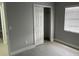 Bedroom featuring tiled floors, a closet and a window for natural light at 1256 S Bumby Ave, Orlando, FL 32806
