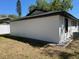 The backyard with a newly renovated stucco house featuring black trim at 1256 S Bumby Ave, Orlando, FL 32806