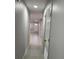 Well-lit hallway featuring neutral paint and tile floor at 1256 S Bumby Ave, Orlando, FL 32806