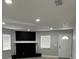 Spacious living room with a decorative fireplace and large windows for natural light at 1256 S Bumby Ave, Orlando, FL 32806