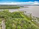 Aerial view of the community featuring a waterfront park with a gazebo and winding path at 1373 Williams Rd, Winter Garden, FL 34787