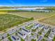 Aerial view of neighborhood featuring solar panels, nearby lake and conservation areas at 1373 Williams Rd, Winter Garden, FL 34787