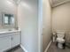 Well-lit bathroom featuring a single vanity with white cabinets and modern fixtures at 1373 Williams Rd, Winter Garden, FL 34787