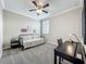 Cozy bedroom featuring neutral walls, a ceiling fan, and plush carpet flooring at 1373 Williams Rd, Winter Garden, FL 34787