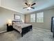 Comfortable bedroom with ceiling fan, windows overlooking the backyard, and a calming color scheme at 1373 Williams Rd, Winter Garden, FL 34787