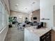 Inviting community clubhouse with cozy seating, stylish decor, a stone fireplace, and a convenient coffee bar at 1373 Williams Rd, Winter Garden, FL 34787
