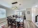 Open-concept dining room area features hardwood flooring and modern lighting fixtures at 1373 Williams Rd, Winter Garden, FL 34787
