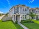 Charming two-story home featuring manicured lawn and a quaint, covered front porch, perfect for curb appeal at 1373 Williams Rd, Winter Garden, FL 34787