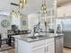 Bright kitchen boasts an island with a sink and stainless steel appliances at 1373 Williams Rd, Winter Garden, FL 34787