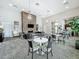 Spacious living area with a stone fireplace, comfortable seating, and a kitchenette at 1373 Williams Rd, Winter Garden, FL 34787
