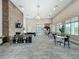 Expansive living area featuring stone fireplace, comfortable seating, and a kitchenette in open concept at 1373 Williams Rd, Winter Garden, FL 34787