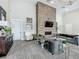 Comfortable living room with stone fireplace, flat screen TV, and stylish decor at 1373 Williams Rd, Winter Garden, FL 34787