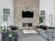 Beautifully staged living room featuring a stone fireplace, flat screen TV, and comfortable seating at 1373 Williams Rd, Winter Garden, FL 34787