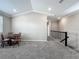 Spacious living area with vaulted ceilings, carpet flooring, and adjacent staircase at 1373 Williams Rd, Winter Garden, FL 34787