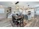 A bright and inviting area with stairs, a dining area, and a kitchen space at 1373 Williams Rd, Winter Garden, FL 34787