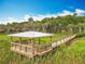 Community park with a wooden pavilion, walkway, and grassy area near the water at 1373 Williams Rd, Winter Garden, FL 34787