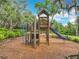 Community playground featuring climbing structures, a slide, and a shaded picnic area at 1373 Williams Rd, Winter Garden, FL 34787