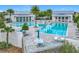 Resort-style community pools with palm trees and modern lounge furniture, perfect for relaxation and socializing at 1373 Williams Rd, Winter Garden, FL 34787