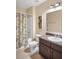 Bathroom featuring a tub, dark wood vanity, and neutral paint at 1688 Tamarind Rd, Davenport, FL 33896