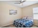 Bedroom with ceiling fan, closet, and a window bringing in lots of natural light at 1688 Tamarind Rd, Davenport, FL 33896