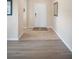 Bright foyer with hardwood flooring, leading to various rooms in the home at 1688 Tamarind Rd, Davenport, FL 33896