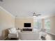 Spacious living room with neutral walls, ceiling fan, and comfortable white sofas for relaxing at 1688 Tamarind Rd, Davenport, FL 33896