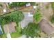 Bird's eye view shows the layout of a residential property with a fenced yard and mature trees at 17 Juniper Dr, Davenport, FL 33837
