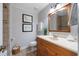 Bathroom features tiled floors and shower with modern vanity and updated light fixtures at 17 Juniper Dr, Davenport, FL 33837