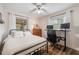 Bedroom features hardwood floors, natural light, and a computer desk at 17 Juniper Dr, Davenport, FL 33837